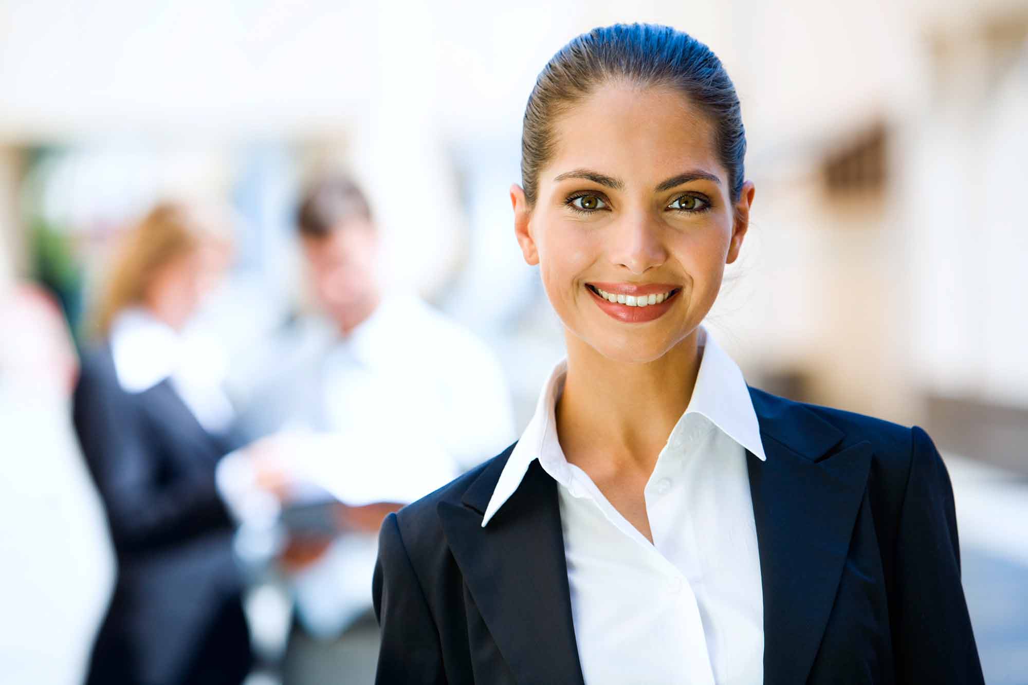 professionally dressed woman looking directly at you